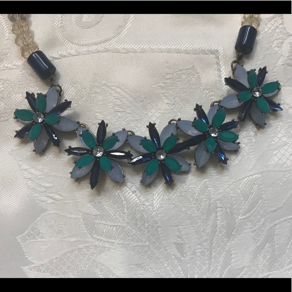 Beaded necklace with floral accents